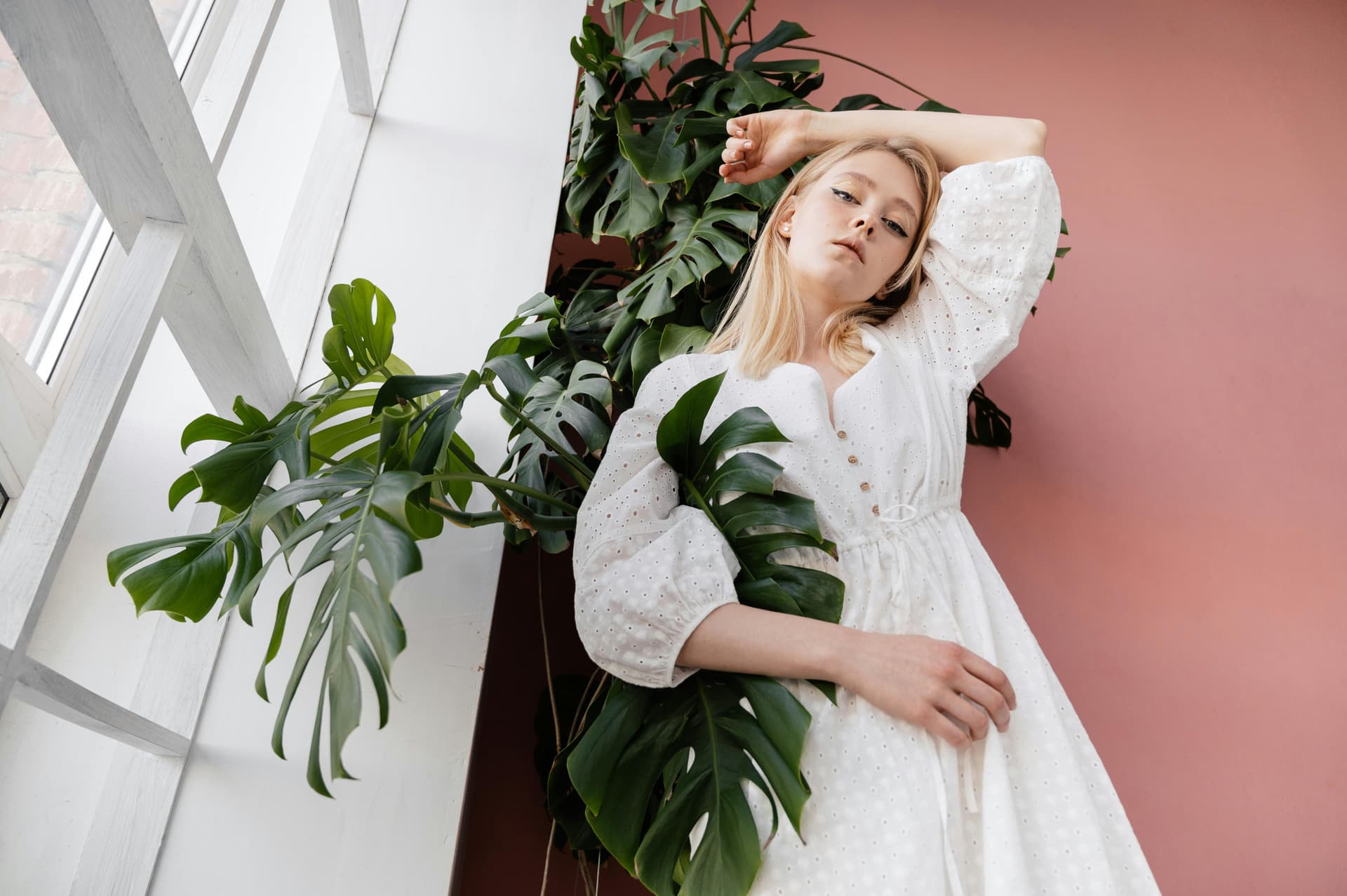 Woman lying down with plants